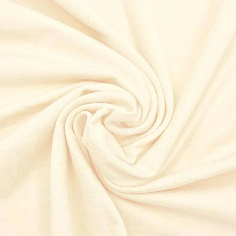 Single jersey knit fabric in cream cotton, manufactured at Apex Corporation knitwear factory in Karachi Pakistan